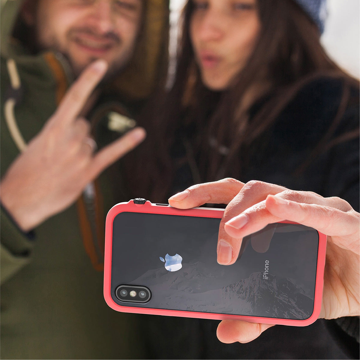 Catalyst Impact Protection Case for iPhone X/XR/Xs/Xs Max showing people using the phone with the catalyst case for selfie outdoor text reads iphone sold separately color shown may differ on the product screen protector not included