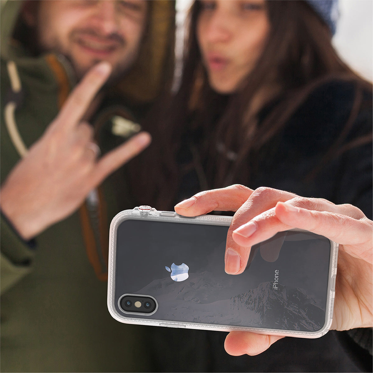 Catalyst Impact Protection Case for iPhone X/XR/Xs/Xs Max showing people using the phone with the catalyst case for selfie outdoor text reads iphone sold separately color shown may differ on the product screen protector not included