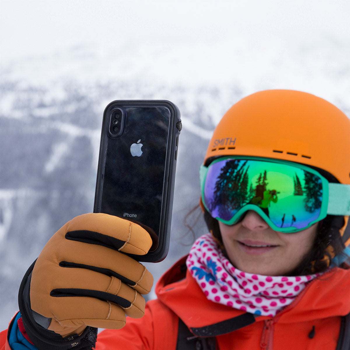 Catalyst iphone x/xr/xs/xs max waterproof case x showing a woman using her phone with the case in stealth black