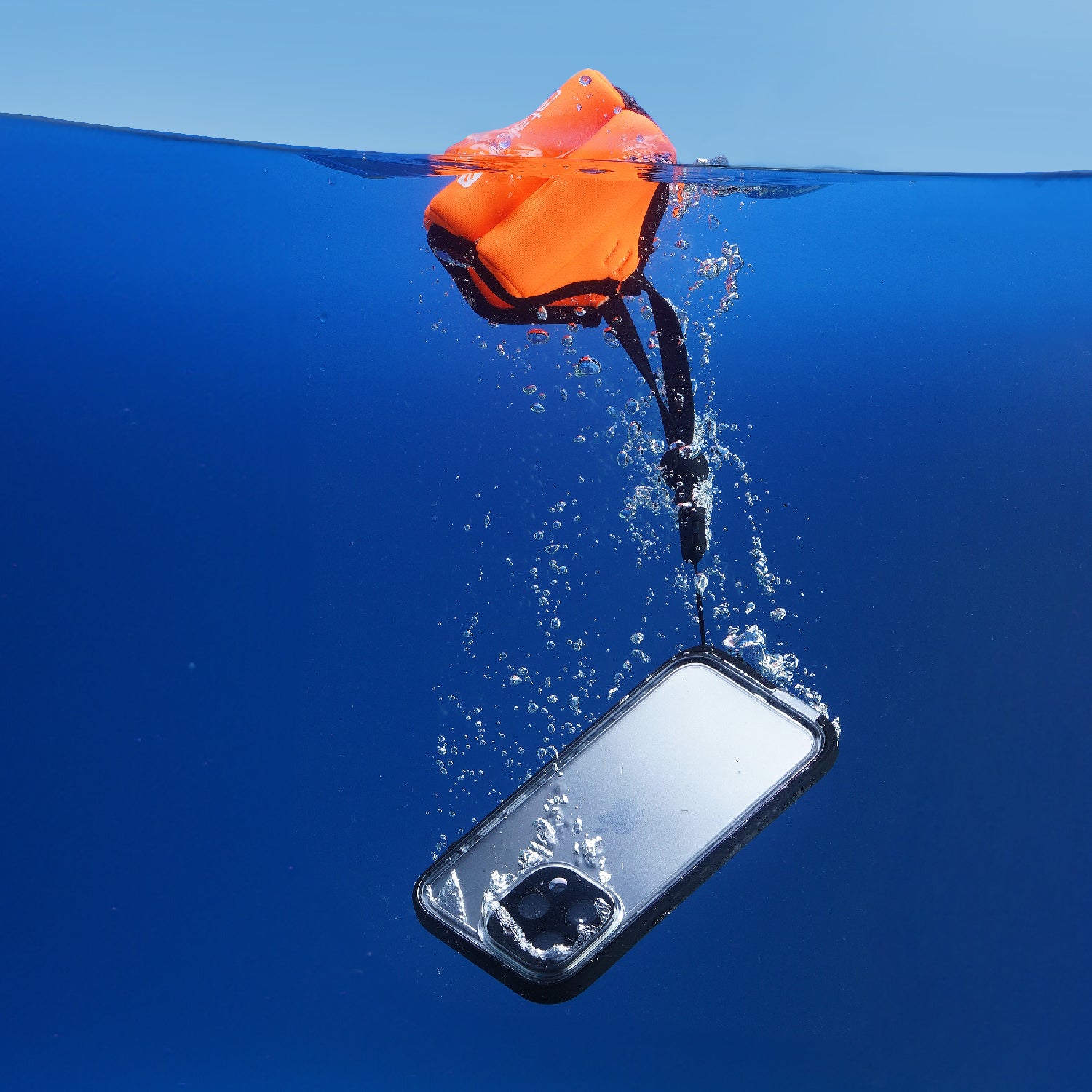 Catalyst Waterproof Case Total Protection iphone 14 series showing the case submerged underwater with orange floating lanyard installed