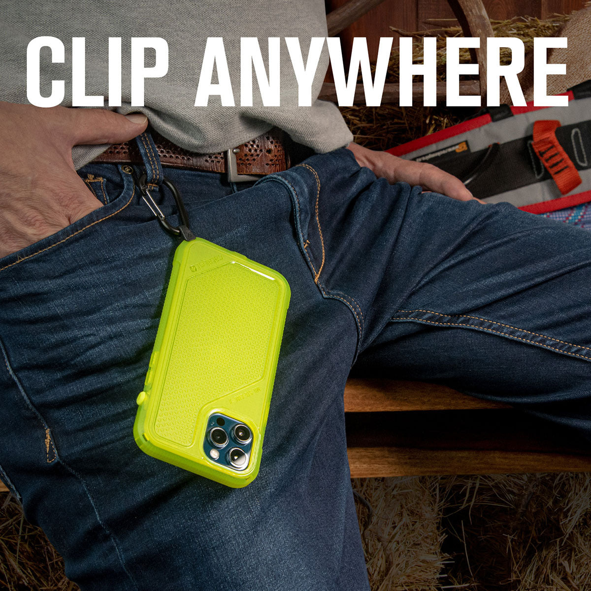 Catalyst carabiner attachment attached on pants lime green with lime green iPhone hanging Text reads clip anywhere