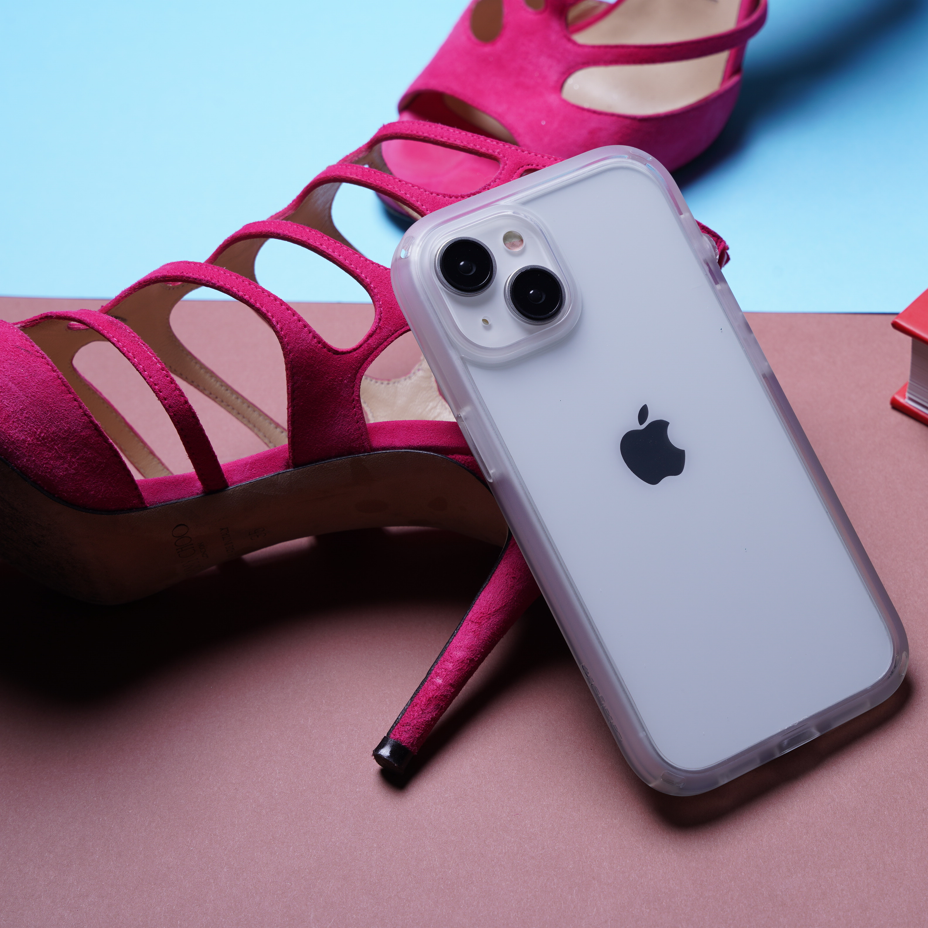 Catalyst iphone 15 series influence case iphone 15 pro in clear colorway leaning on a hot pink high heels
