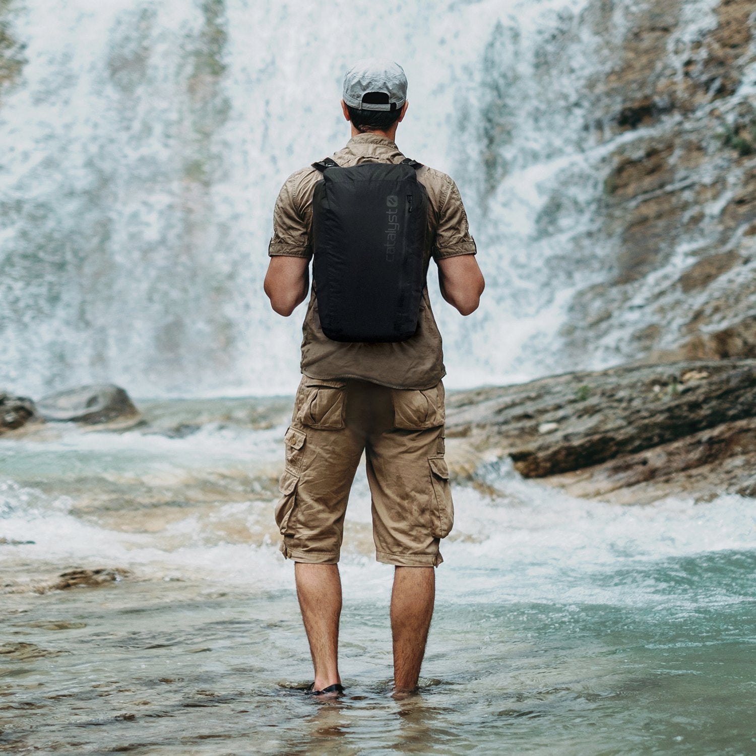 catalyst waterproof 20l backpack man with a cap waterfalls